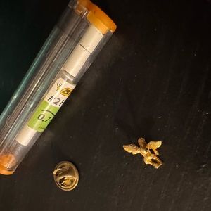 Gold colored baby angel pin